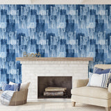 Wall Blush Indigo Wallpaper featured in stylish coastal living room, enhancing wall decor focus.
