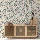 "Paisley & Stone Wallpaper by Wall Blush adorns living room wall, highlighting elegant design focus."
