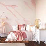 Alt text: Ethereal Wallpaper from The Clements Crew Line in a stylish child's bedroom, showcasing the elegant pink marble pattern as a focal point.
