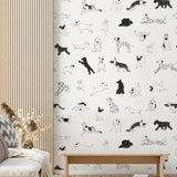 Puppy Love Wallpaper by Wall Blush, featuring playful dogs, perfect for a cozy modern living room decor.
