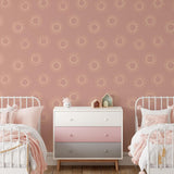 Wall Blush's Sun Kissed Wallpaper in a cozy twin bedroom with stylish pink decor accents
