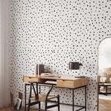 "Wall Blush PERIOD. Wallpaper in a modern home office, with focus on stylish black and white dot design."