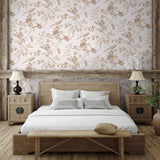 "Pemberly floral wallpaper by Wall Blush accentuates rustic bedroom decor and wooden furniture."