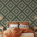 Stylish Jude Wallpaper from The Stefanie Bloom Line in a cozy bedroom interior with decorative bed and accessories.
