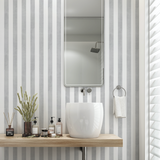 Modern bathroom featuring Gabbandra Stripes Wallpaper by The 7th Haven Interiors Line, highlighting the wall design.
