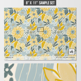 Amelia Wallpaper sample patterns in yellow and blue by Wall Blush for a vibrant living space focus.
