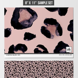Alt text: Cheetah Blush Wallpaper by Wall Blush displayed as samples, ideal for chic interior decor focus.

