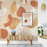 "Wall Blush Solstice Wallpaper featured in a modern living room, with abstract design as the focal point."