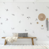 "Minimalistic living room featuring Wall Blush 'Of a Feather (White) Wallpaper' design on wall."