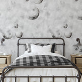 To the Moon Wallpaper by The Minty Line in modern bedroom with moon phase patterns as focal point.
