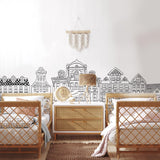 Madeline (White) Wallpaper by Wall Blush adorning nursery walls with elegant building sketches.
