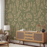 Adventure Awaits (Green) Wallpaper from The Rayco Line displayed in a stylish living room, highlighting wall decor.
