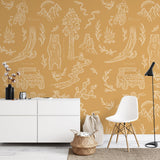 "Wall Blush 'Adventure Awaits (Orange)' wallpaper in modern home office setting, showcasing vibrant design focus."