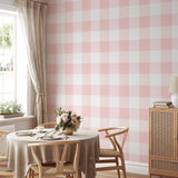 "Wall Blush's Annabelle Wallpaper in a modern dining room with pink and white checkered design, focusing on elegance."