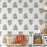 Be Nice Or Leaf Wallpaper from The Salem Gideon Line enhancing a cozy nursery room's decor
