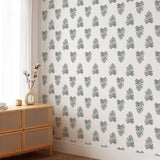 "Wall Blush's Be Nice Or Leaf Wallpaper in a stylish living room, accenting the space with elegant foliage patterns."