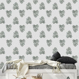 Be Nice Or Leaf Wallpaper by The Salem Gideon Line in a stylish bedroom, highlighting the interior decor.
