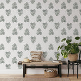 "Be Nice Or Leaf Wallpaper by Wall Blush showcasing in a modern living room, highlighting the elegant wall design."