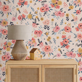 In Bloom (Blush) Wallpaper by Wall Blush accentuates living room wall with vibrant floral design.
