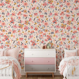 In Bloom (Blush) Wallpaper by Wall Blush enhancing a cozy bedroom, with a floral focus for home decor.
