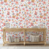 In Bloom (White) Wallpaper by Wall Blush enhancing a cozy entryway, focused on floral design.
