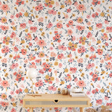 Wall Blush's In Bloom (White) Wallpaper featured in a well-decorated home office space, emphasizing style and quality.
