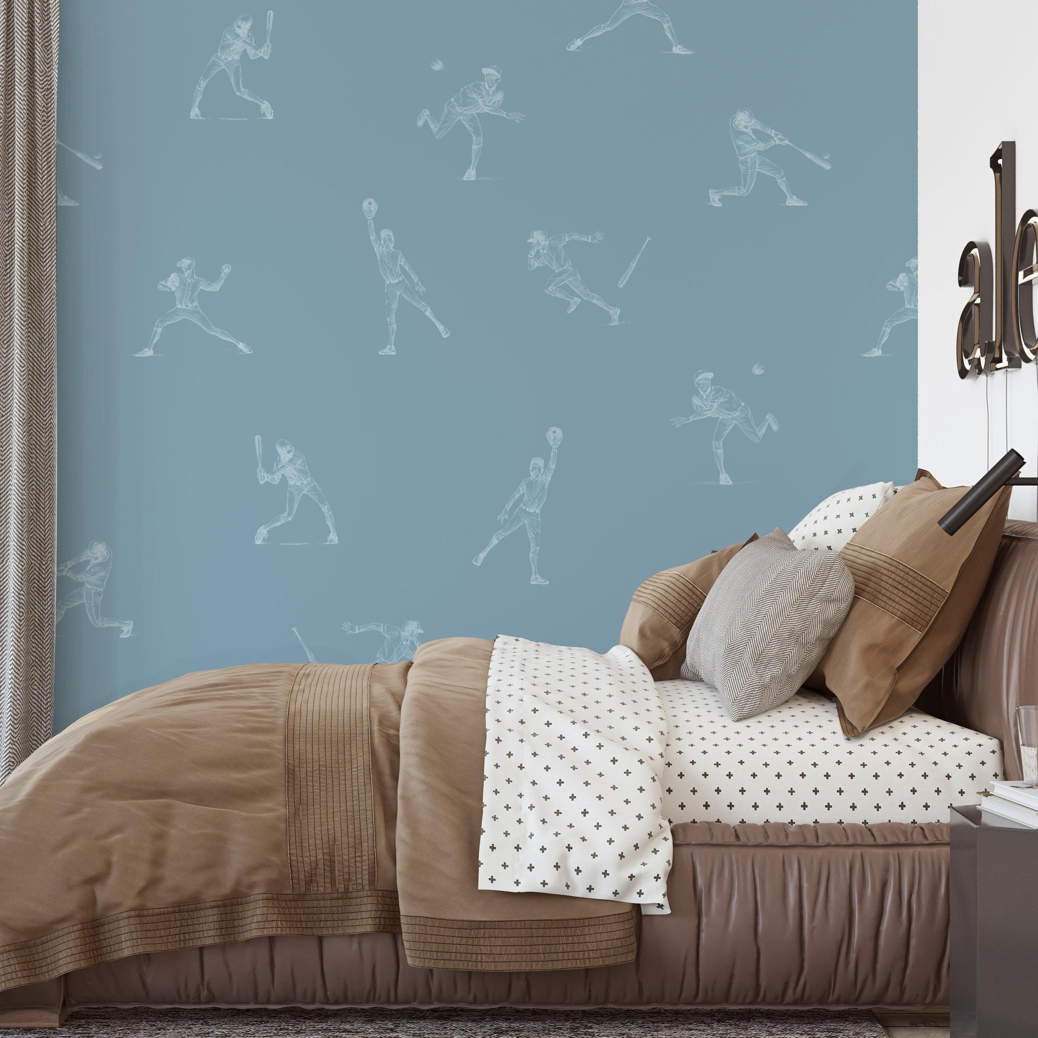 Batter's Up (Blue) Wallpaper by Wall Blush SM01 in a cozy bedroom interior highlighting the playful baseball-themed design.
