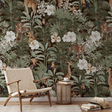 "Wall Blush's Tanzania Wallpaper in dark brown adorns a cozy living room, showcasing exotic fauna and flora."