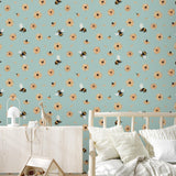 Bumble (Blue) Wallpaper by Wall Blush in a cozy bedroom, highlighting the playful bee design.
