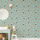 "Bumble (Blue) Wallpaper by Wall Blush in a stylish bathroom, highlighting the floral and bee design."