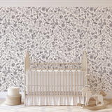 Eloise Wallpaper by Wall Blush SG02 in a cozy nursery room, accentuating the space with its elegant floral design.
