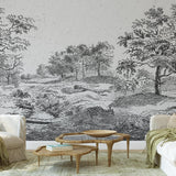 Midsummer Wallpaper by Wall Blush SG02 enhances a cozy living room with its detailed landscape design.
