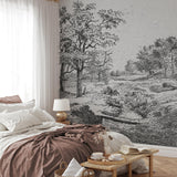 "Midsummer Wallpaper by Wall Blush in a cozy bedroom setting, showcasing the detailed forest design."