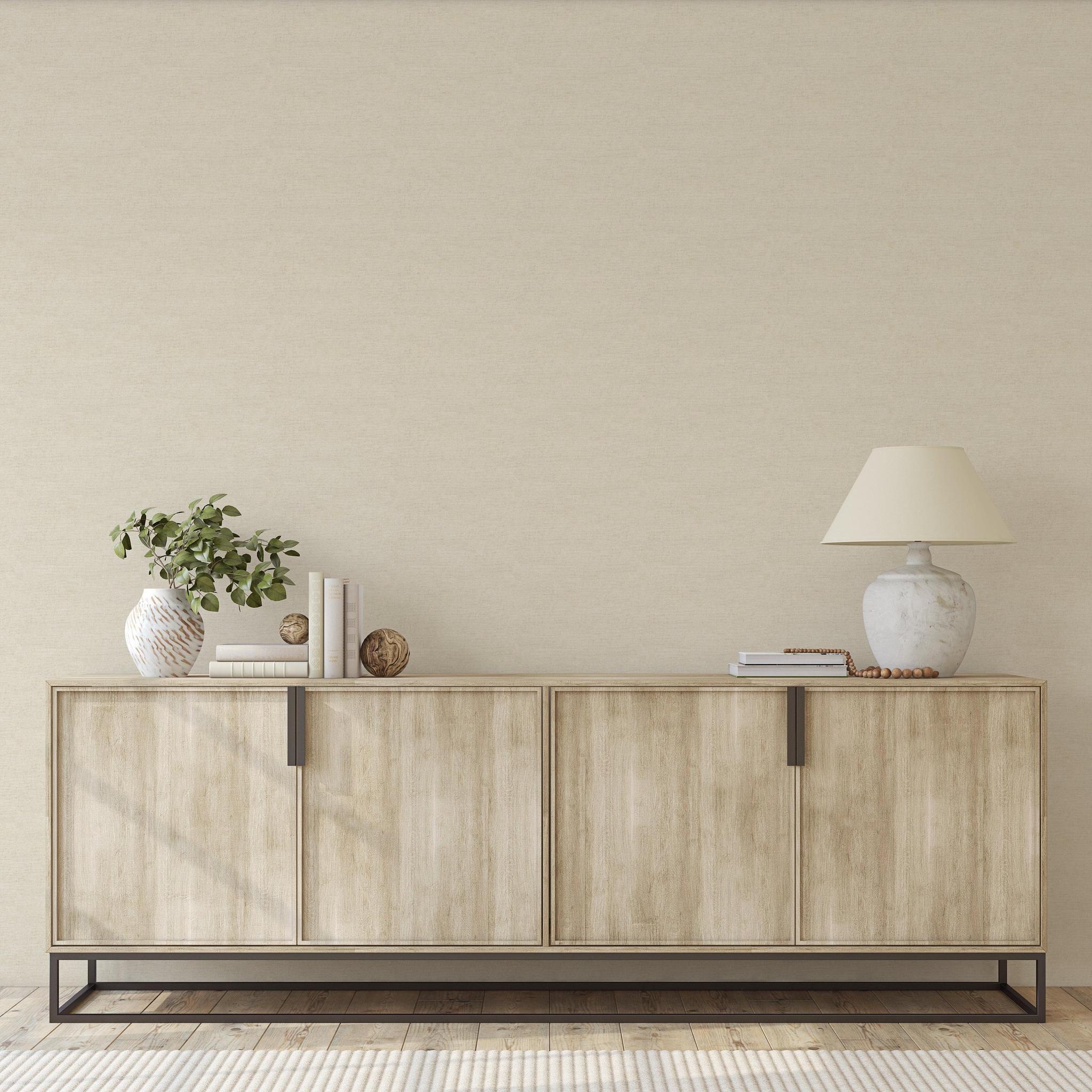 Carefree (Beige) Wallpaper by The Clements Crew Line in a modern living room, highlighting wall texture focus.
