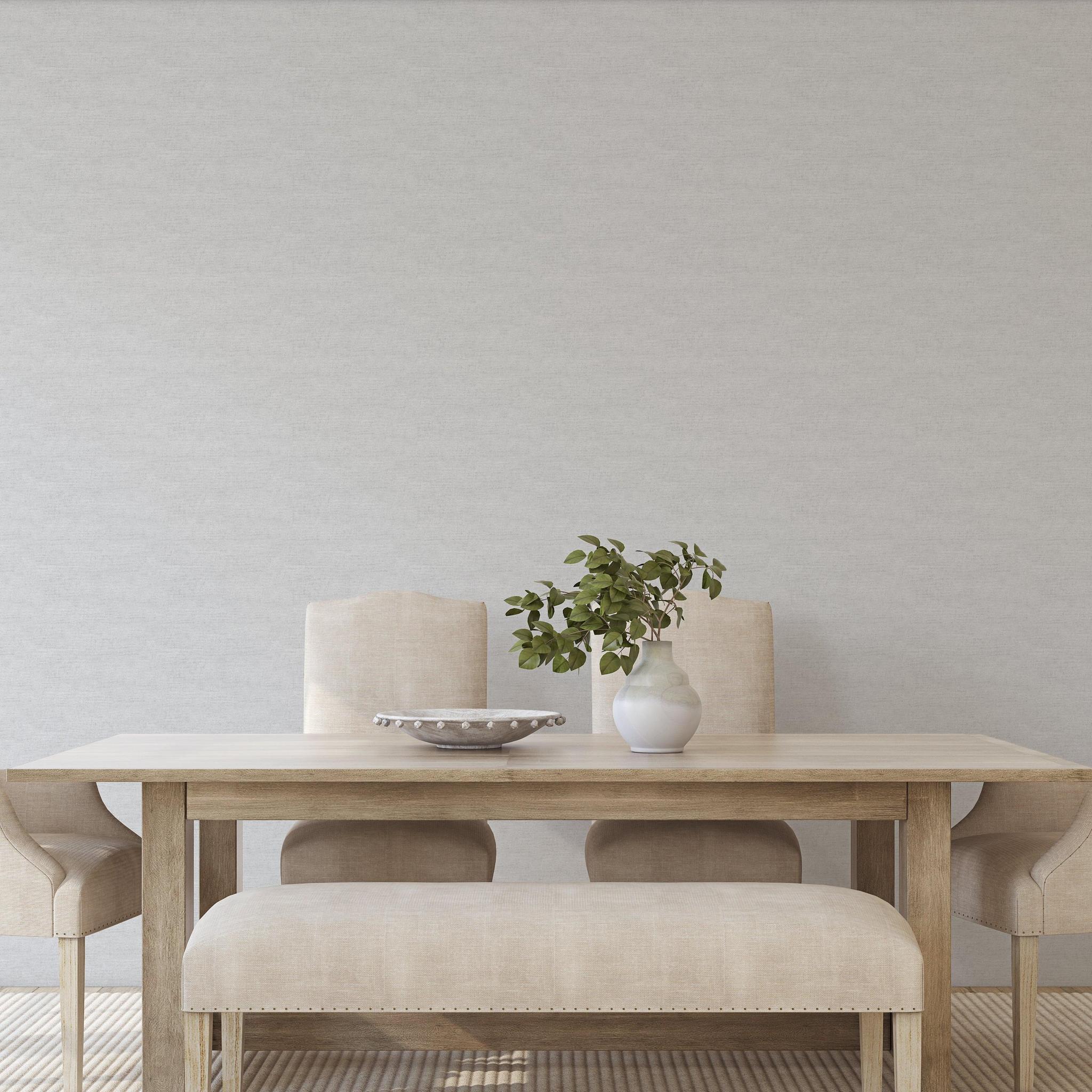 Carefree (Grey) Wallpaper by The Clements Crew Line in a modern dining room setting, highlighting the elegant wall design.
