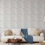 Charlie Black and White Wallpaper from The Chelsea DeBoer Line in cozy living room setting, focus on wall decor.
