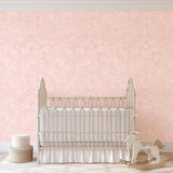Charlotte's Chantilly Wallpaper in a nursery by The 7th Haven Interiors Line with cream crib and rocking horse.
