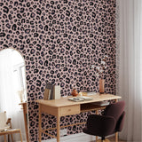 "Cheetah Blush Wallpaper by Wall Blush featured in a chic home office setting, showcasing the bold pattern."