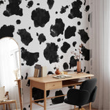 "Greta Wallpaper by Wall Blush in a stylish home office, showcasing unique black splatter design."
