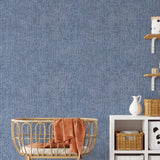 Levi Wallpaper in blue texture design by Wall Blush SG02, enhancing a cozy nursery room wall.
