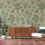 Desert Dreamer (Green) Wallpaper by The Rayco Line in a stylish living room setting focused on wall decor.
