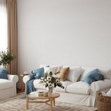 Alt: "Elegant living room featuring Wall Blush's Doodle Dot Wallpaper, accentuating modern home decor and simplicity."