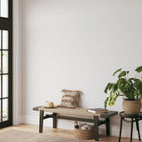 "Doodle Dot Wallpaper by Wall Blush in a cozy living room, enhancing the decor with its minimalist design."