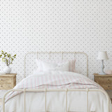 Doodle Dot Wallpaper by Wall Blush in a stylish, minimalist bedroom highlighting the elegant wall pattern.
