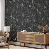 The Dutchess (Black) Wallpaper from The Ania Zwara Line in a stylish living room.
