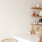"Wall Blush Earthy Terrazzo Wallpaper in a modern kitchen, featuring warm, neutral tones and minimalist decor."