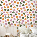 Alt: Colorful Let's Hang Wallpaper by Wall Blush SG02 featured in a cozy nursery room, with playful animal patterns.
