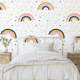 Wall Blush Funfetti Wallpaper enhancing a modern bedroom's aesthetic with playful rainbow patterns.
