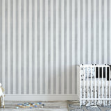 Gabbandra Stripes Wallpaper from The 7th Haven Interiors Line showcased in a modern nursery room.
