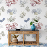 "Wall Blush Great Barrier Wallpaper adorning the walls of a stylish, coastal-themed entryway room."